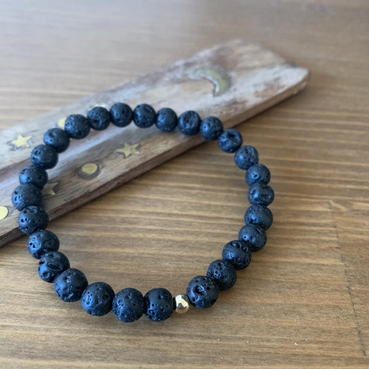 Lava stone bracelet, 9k gold