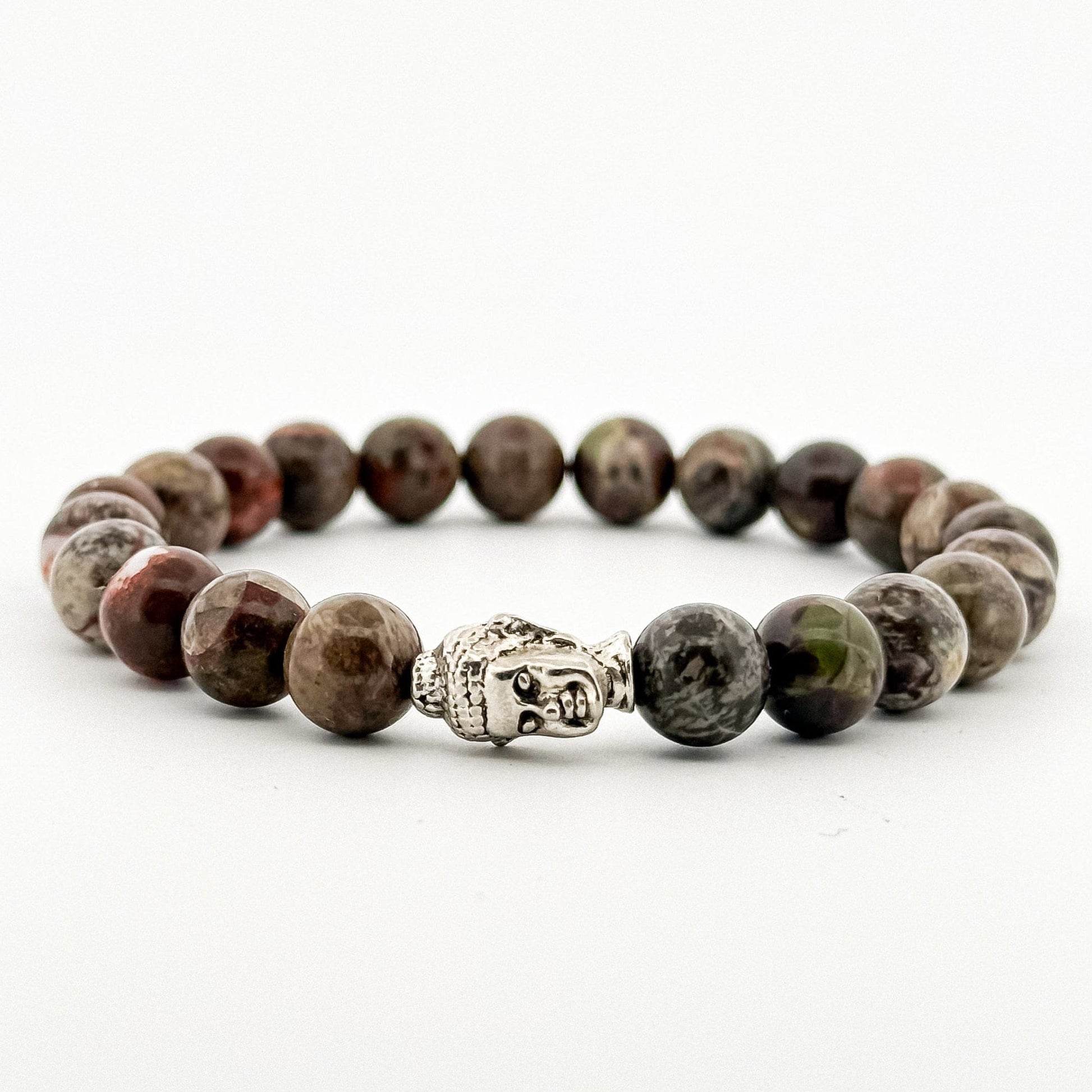 Beaded bracelet with a Buddha charm on a white background