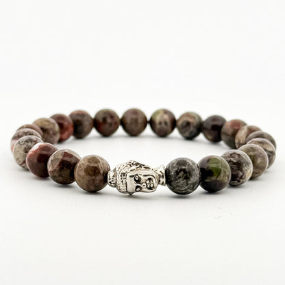Beaded bracelet with a Buddha charm on a white background