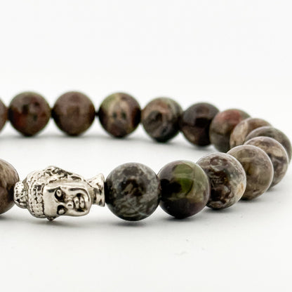 Beaded bracelet with a Buddha charm on a white background