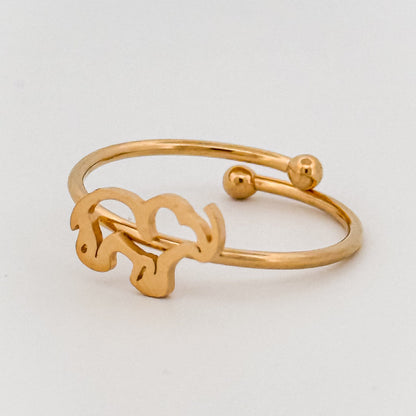Gold bracelet on a light gray background