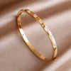 Melba Gold Bangle, with 7 cubic zirconia stones | Mi Cielo London