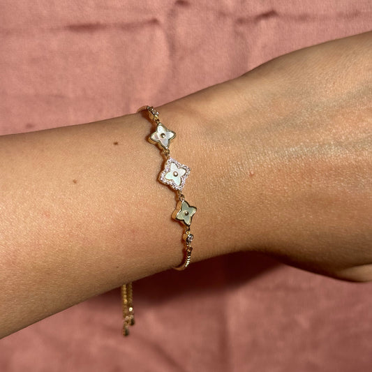 Gold bracelet with flower-shaped charms 