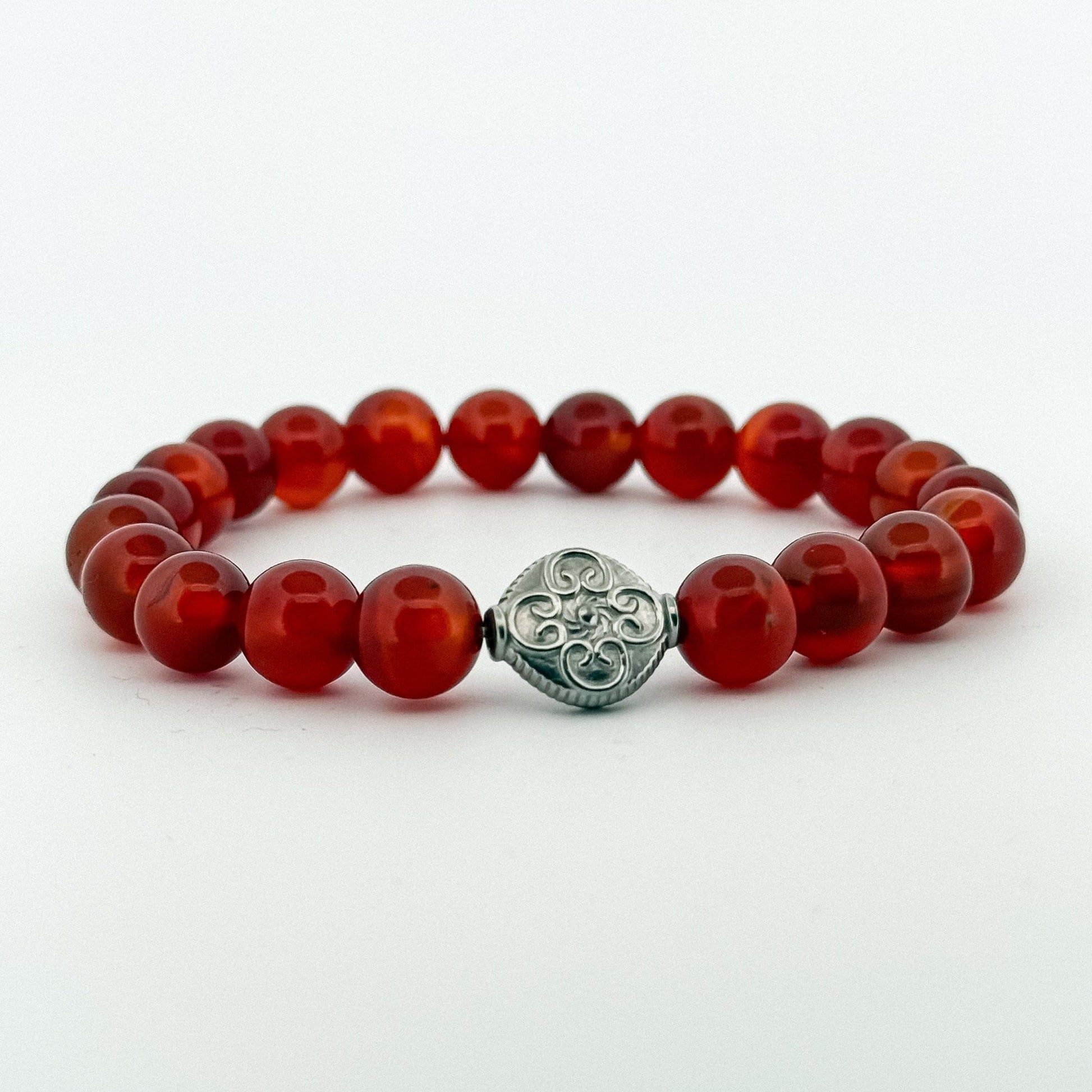 Red Carnelian stones bracelet with a silver engraved coin with flower