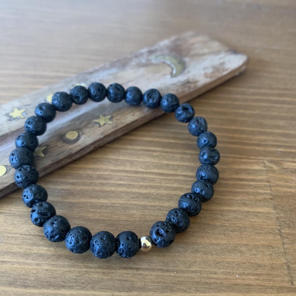 Lava stone bracelet, 9k gold