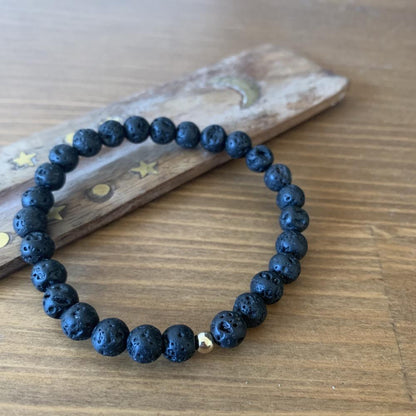 Lava stone bracelet, 9k gold